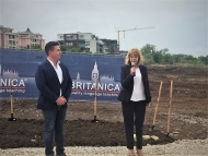 Starts construction of a school and kindergarten 